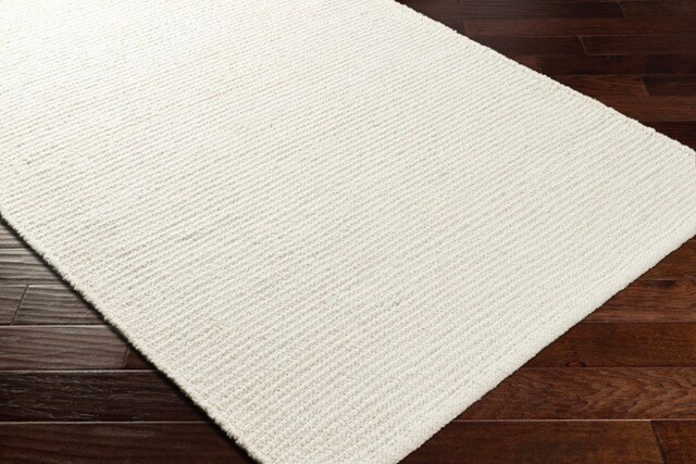 Hand Woven Ivory Rug on Floor